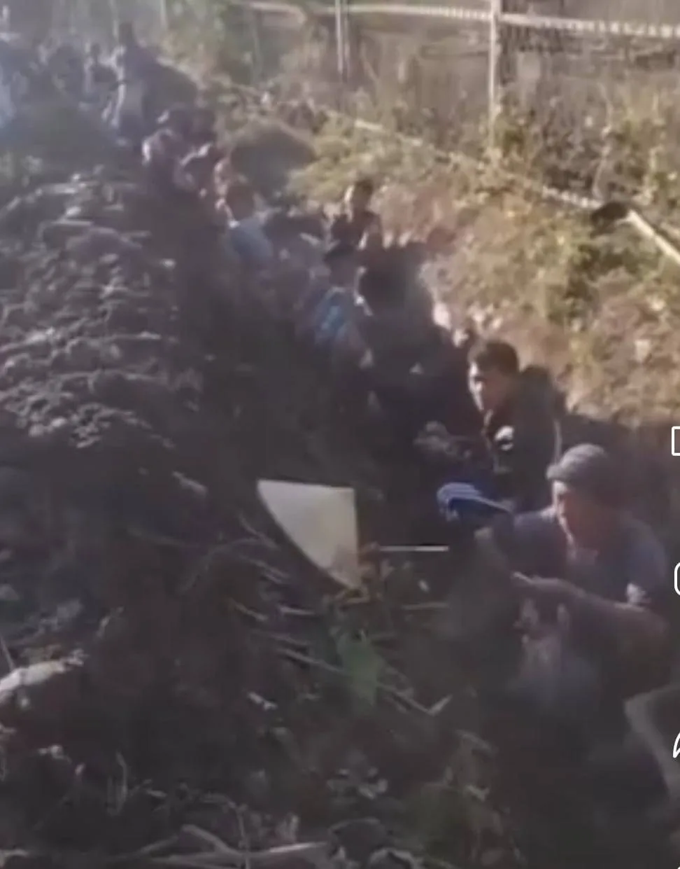 Displaced families taking shelter in trenches along the Myanmar–China border